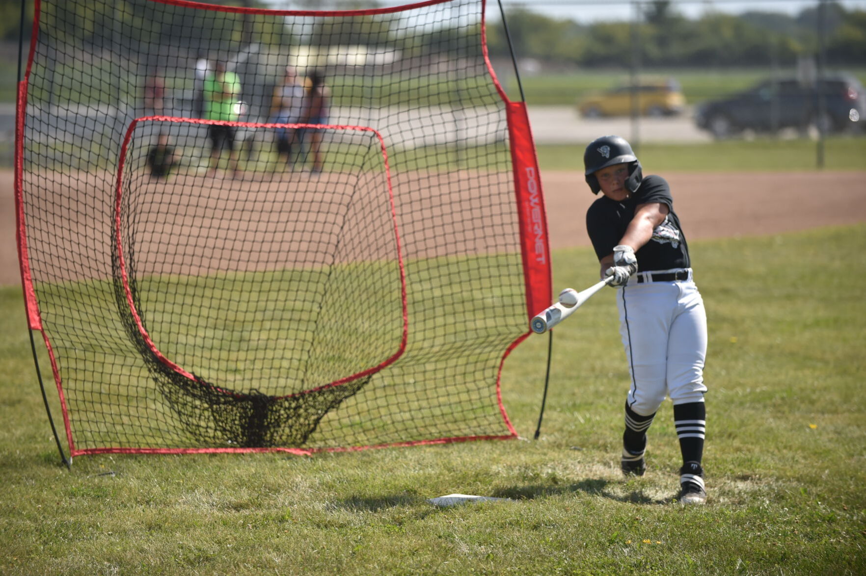 Tabin Nass gets the barrel of the bat on the ball